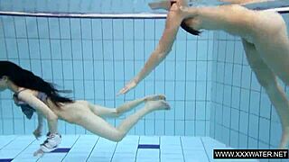 Shaved brunette with big tits underwater?