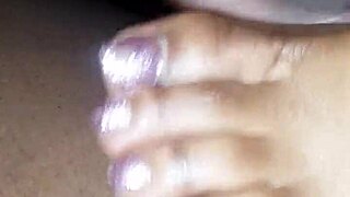 In this scene, soft toes playfully tease a throbbing dick