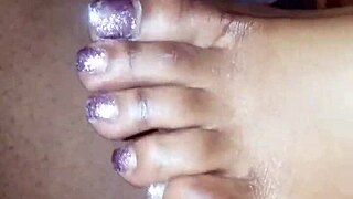 In this scene, soft toes playfully tease a throbbing dick