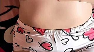 Colombian girl gets aroused watching a porn video on her bed