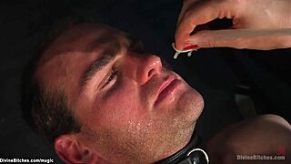 Femdom drains condom onto slave's face during rough session.
