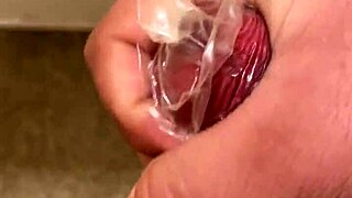 Milk spurting everywhere as i cum hard masturbating with condom!!