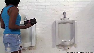 ebony babe fingers pussy while blowing huge cock at gloryhole