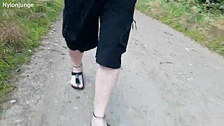 german chubby walks barefoot in birkenstocks through nature outdoors