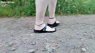 german chubby walks barefoot in birkenstocks through nature outdoors