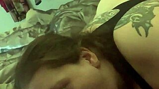 redhead tattooed babe slurps sloppy on huge black cock toy