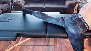 Bodybuilder Stretches In Leggings On MASSAGE TABLE HD Compression