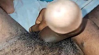 in this amateur scene a black beauty strokes big monster cock with intense handjob rhythm building to explosion