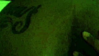 Black woman shows off her fat tattooed ass in close up