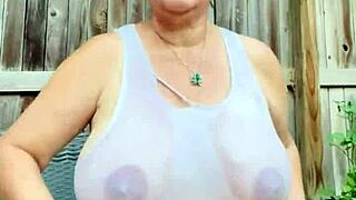 wet shirt clings to massive tits